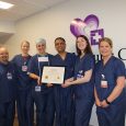 Cardiac team with re-accreditation certificate