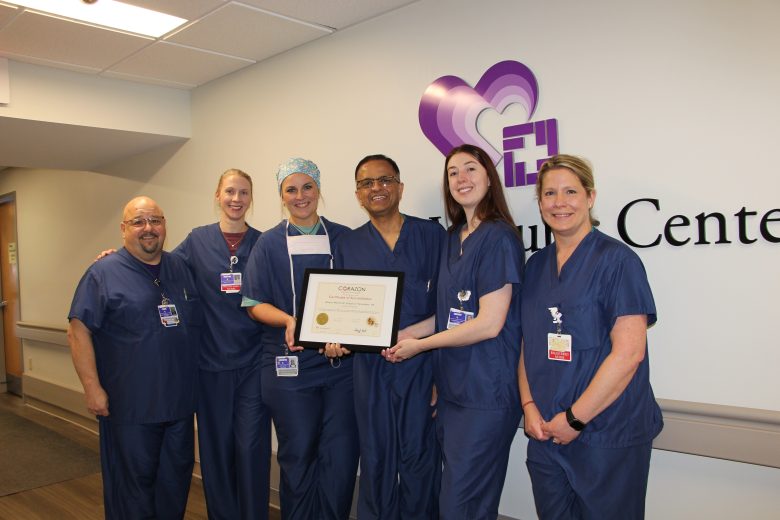 Cardiac team with re-accreditation certificate